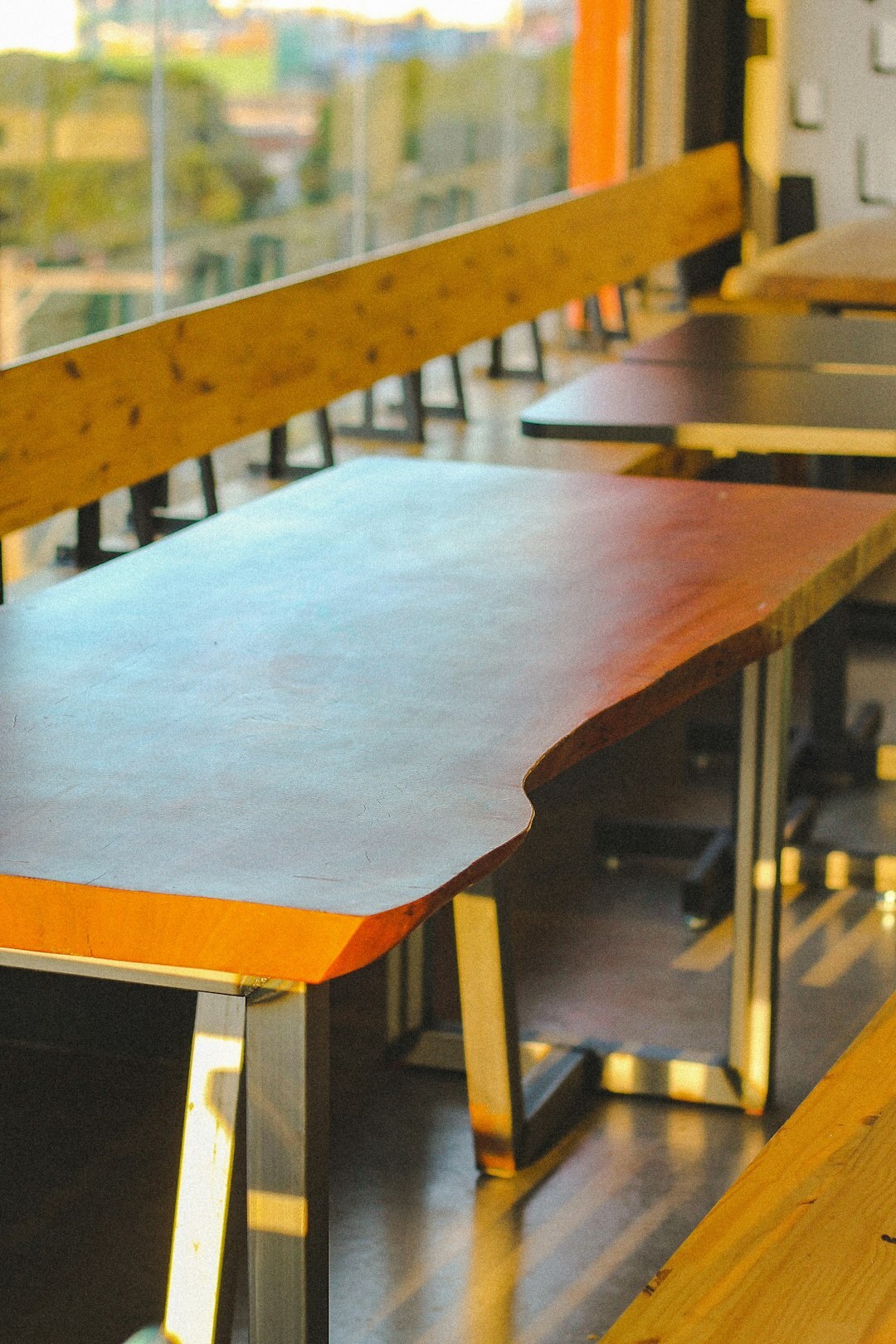 Diverse team discussing around a table with laptops